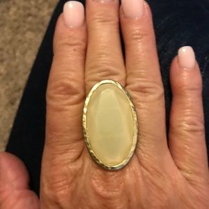 Cream stone in gold setting